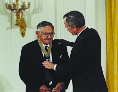 Receiving Medal of Art from President Bush.
